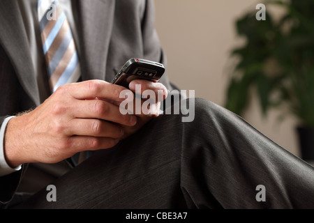 Business man text messaging Stock Photo