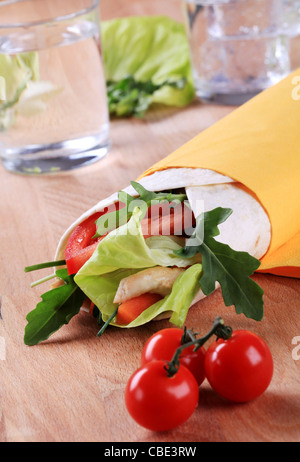 Wrap sandwich with chicken meat and vegetables Stock Photo
