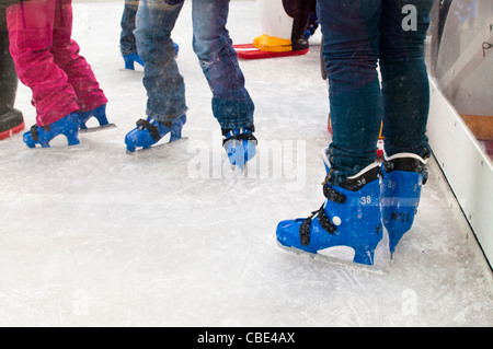 Close up of People in Ice Skating Boots on a Public Ice Rink, Westfield Shopping Centre, East London, UK Stock Photo