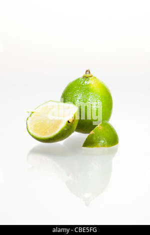 Sliced lime with reflection in front of white background Stock Photo