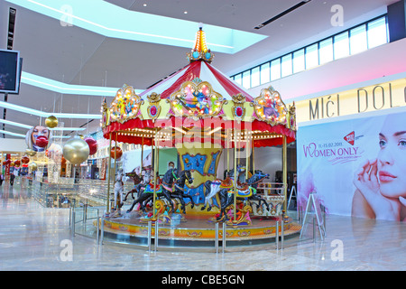 Merry-go-round, child attraction in shopping mall Stock Photo