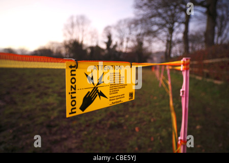 Electric fence warning sign. Stock Photo