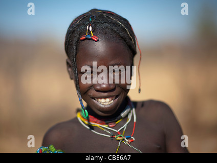 Portrait of a smiling Muhacaona tribe girl, Cunene Province, Oncocua ...