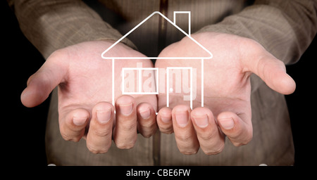 line-art house in human hands Stock Photo