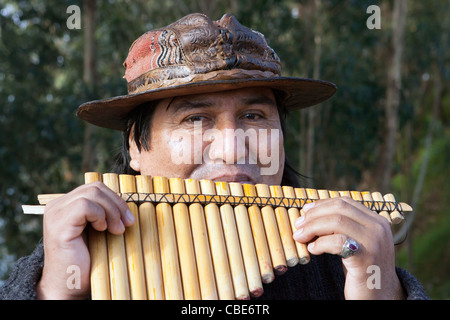 South American Peruvian Indian man playing the Pan pipes in Madeira, Stock Photo