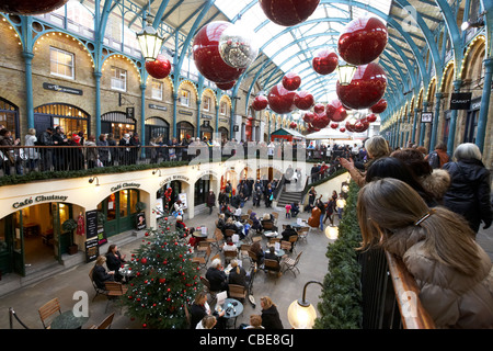 string quartet playing in covent garden during christmas shopping london england united kingdom uk Stock Photo
