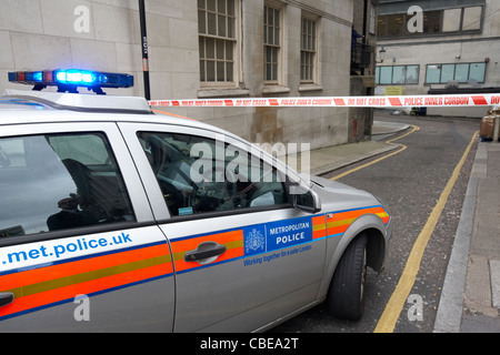 metropolitan police squad car with police inner cordon do not cross warning tape at incident london england uk united kingdom Stock Photo