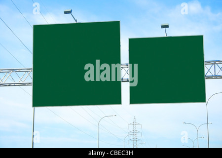 Empty billboard on highway towers. Stock Photo