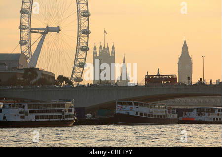 London skyline at dusk in Autumn, looking across the Thames, to Waterloo Bridge, with the London Eye, Big Ben and the HOP behind Stock Photo