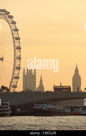 London skyline at dusk in Autumn, looking across the Thames, to Waterloo Bridge, with the London Eye, Big Ben and the HOP behind Stock Photo