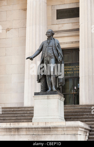 A statue of George Washington stands in front of the Federal Hall National Memorial on Wall Street in New York City. Stock Photo