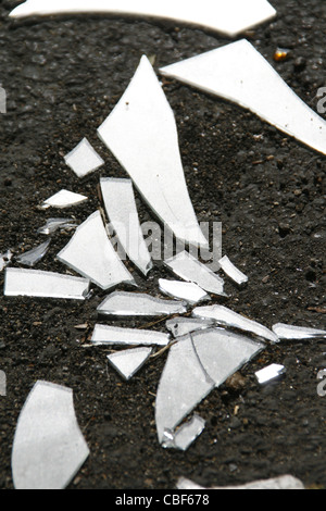 smashed broken glass window pane on floor ground Stock Photo