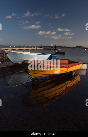 Boats on the Alde Estuary, at Orford harbour, with Orford Ness in the background. Suffolk, England Stock Photo