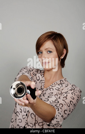 woman with a bike horn making a noise Stock Photo