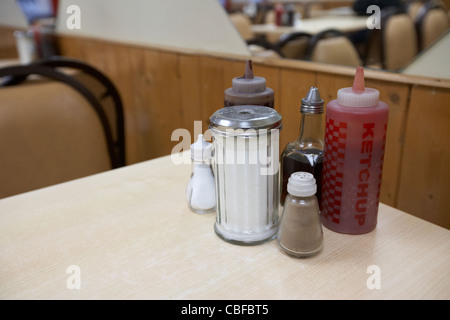 condiments sauces and sugar on a table in a cafe in london england united kingdom uk Stock Photo