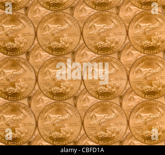 Gold Eagle one ounce coins in a patterns and stacked on each row