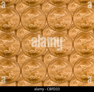 Gold Eagle one ounce coins in a patterns and stacked on each row