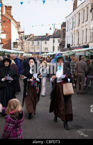 Louth Victorian Market,  Lincolnshire, England ladies wearing bonnets in Cornmarket Stock Photo