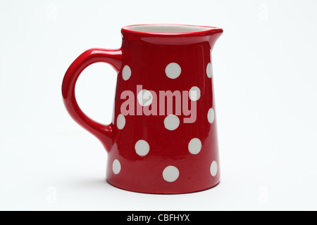 ceramic red spotty milk jug Stock Photo