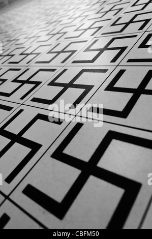 Floor tiles with Swasticas, inside Oskar Schlindler's factory, Krakow, Poland Stock Photo