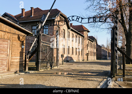 Main entrance to Auschwitz I Nazi concentration camp with sign 'Arbeit Macht Frei' Stock Photo