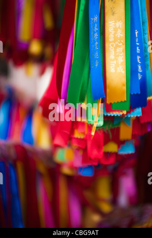 Detail of colored prayer ribbons Stock Photo