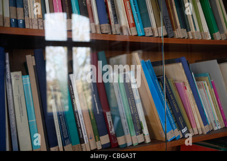 Rows of books behind glass doors Stock Photo