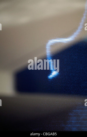 Blue refracted light with ceiling and window in background Stock Photo