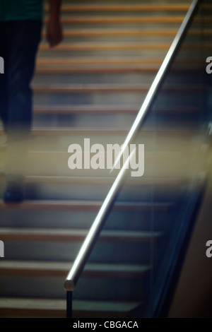 Man walking down stairs Stock Photo