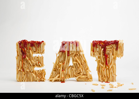French fries molded to make the word FAT Stock Photo