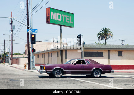 Car passing motel in Los Angeles, California Stock Photo