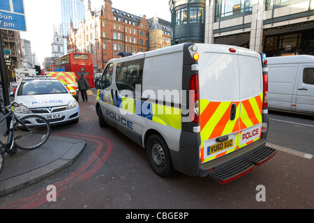 city of london police vehicle van parked on double red lines london england uk united kingdom Stock Photo