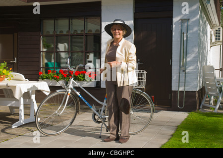 Femal in her early 70s dressed up for a party Finland Europe Stock Photo