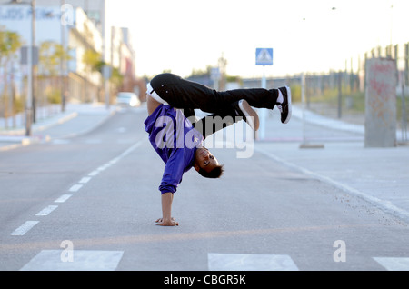 Breakdancer John Lartey performs in the street Stock Photo