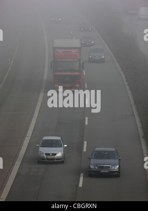 Motorway, Autobahn A52, traffic in thick fog. Essen, Germany, Europe.
