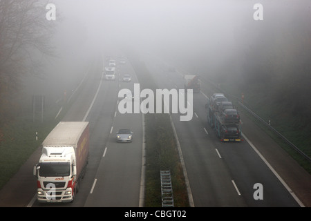 Motorway, Autobahn A52, traffic in thick fog. Essen, Germany, Europe.