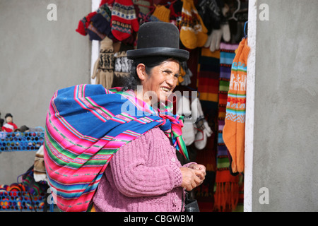 Native Bolivian woman wearing traditional dress and bowler hat in Colchani, Altiplano, Bolivia Stock Photo