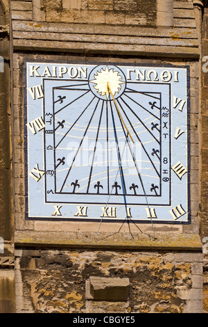 Sundial on the south wall of Ely Cathedral Cambridgeshire with a quote from Pittacus Kairon Gnothi or Know your Opportunity Stock Photo