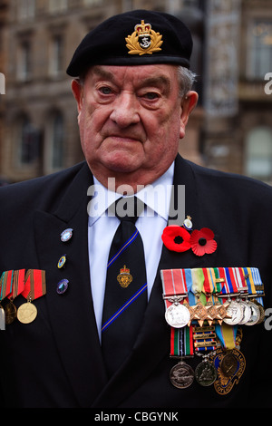 War veteran wearing his war medals at the remembrance Day Parade, George Square, Glasgow, Scotland, UK Stock Photo