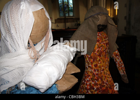 Children's nativity scene of Mary holding baby Jesus with Joseph Stock Photo