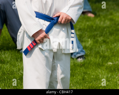 TaeKwonDo school practice on lawn in the park. Stock Photo