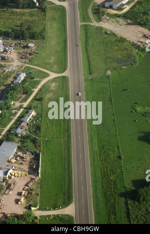 Aerial view of road in green fields in Uruguay.  Stock Photo