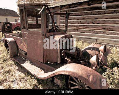 An old rusted Ford truck sits on a farm. Museum of the Mountain West in Montrose, Colorado. Stock Photo