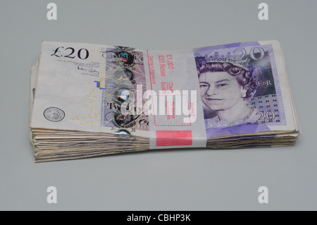 Bank wrapped bundle of one thousand pounds in twenty pound notes. Stock Photo