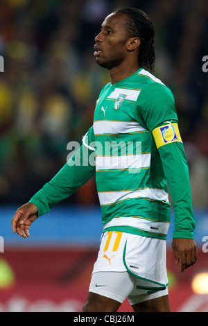 Côte d'Ivoire team captain Didier Drogba in action during a 2010 FIFA World Cup match against Brazil. Stock Photo