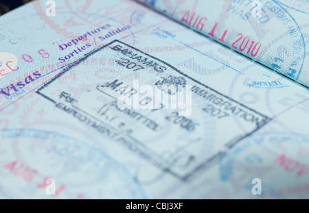 Macro image of visa and immigration stamps in US passport for Bahamas Stock Photo