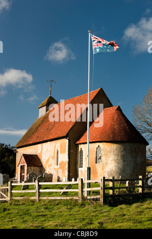 Church of  St Mary The Virgin, Upwaltham, West Sussex on the South Downs with patchwork flag commemorating World War Two dead Stock Photo