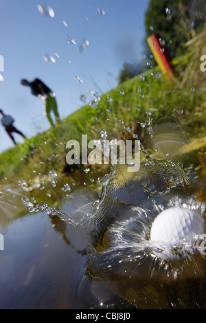 Two men playing golf, Prien am Chiemsee, Bavaria, Germany Stock Photo
