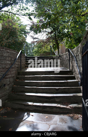 Sunlit stone steps at the entrance to Stock Photo