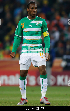 Côte d'Ivoire team captain Didier Drogba in action during a 2010 FIFA World Cup Group match against Brazil. Stock Photo